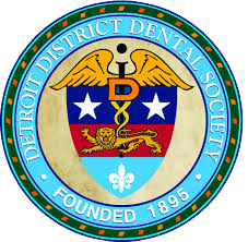 The image displays a logo for the Detroit District Dental Society, which is an organization dedicated to dental education and research.