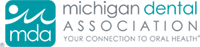 The image is a screenshot of a webpage with a logo for the 'Michigan Dental Association' at the top, followed by a grey background and some text that appears to be in a language other than English.